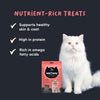 Meowsi by HUFT Salmon & Chicken Soft Cat Treats, 50 gm, features a pink packaging with a cat graphic and treats displayed.