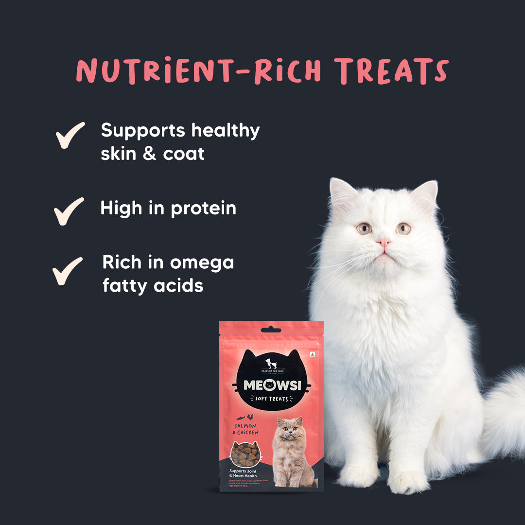 Meowsi by HUFT Salmon & Chicken Soft Cat Treats, 50 gm, features a pink packaging with a cat graphic and treats displayed.